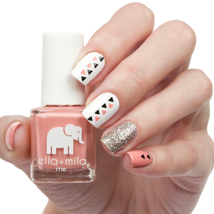 Cotton Candy peachy pink nail polish with white, black triangle and gold glitter accent nails