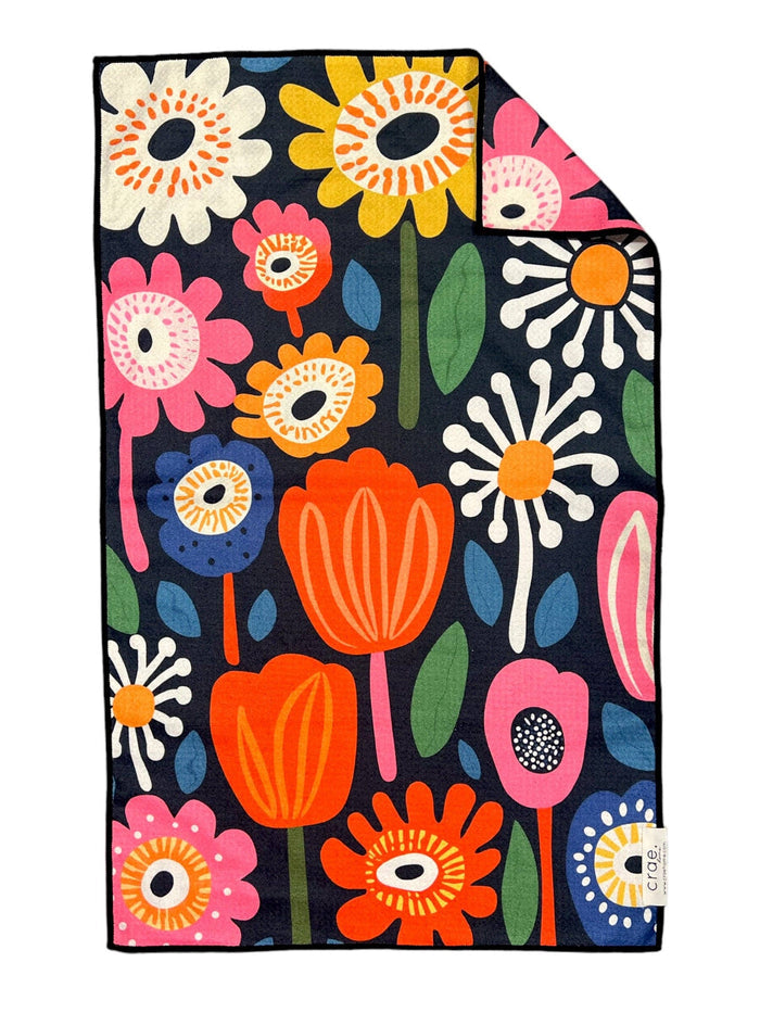 Colorful floral patterned blanket on a white background