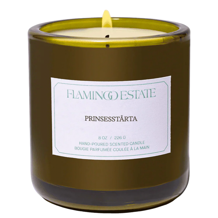 Flamingo Estate Green glass candle vessel with a white label prinsesstarta fragrance label 8oz