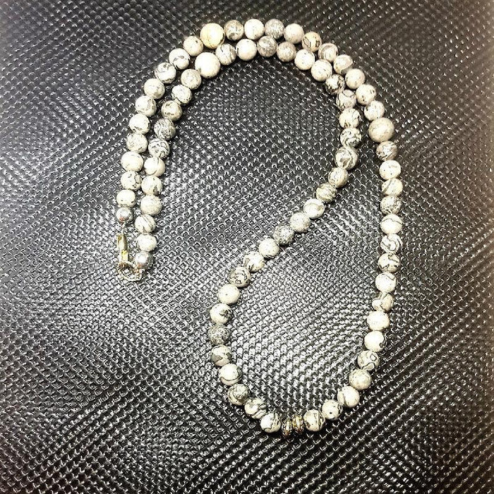 Grey Jasper Bead NecklaceGrey Jasper Bead Necklace
This exquisite Grey Jasper Bead Necklace is crafted to provide strength, stability, and grounding, making it the perfect accessory for any Beaded NecklaceT.M.JTheodore Men's JewelryGrey Jasper Bead Necklace