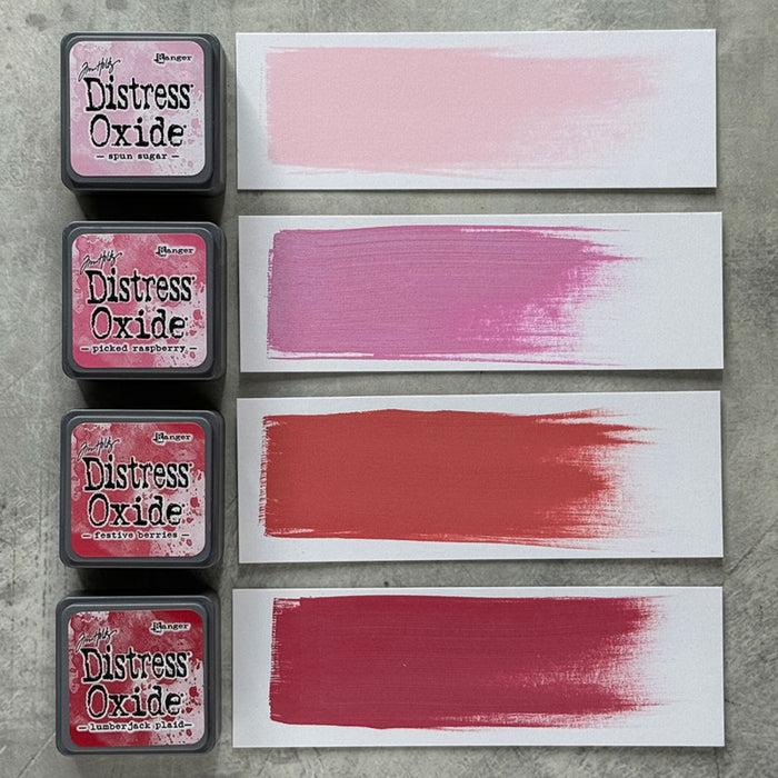 Ranger - Tim Holtz - Distress Mini Oxide Ink Pads Kit, #1 (4pc). Colours: Spun Sugar, Picked Raspberry, Festive Berries and Lumberjack Plaid. Available at Embellish Away in Bowmanville Ontario Canada.