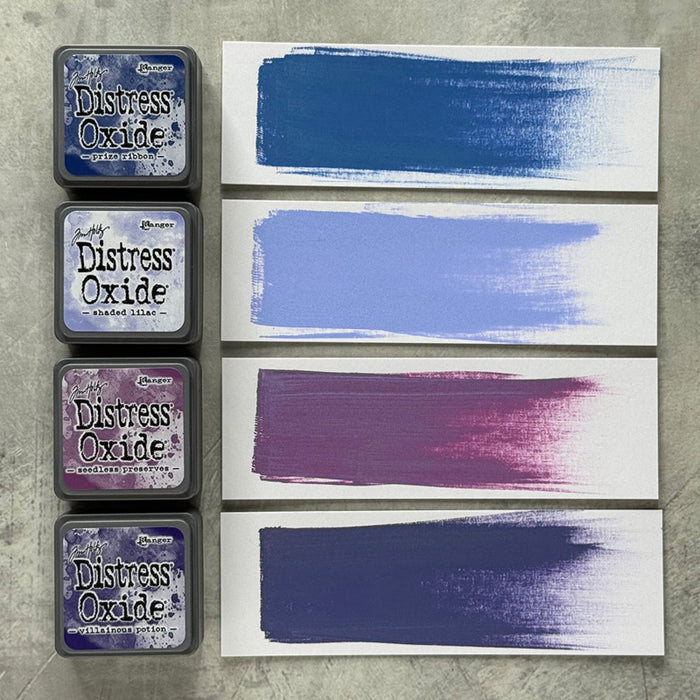 Ranger - Tim Holtz - Distress Mini Oxide Ink Pads Kit, #5 (4pc). Colours: Prize Ribbon, Shaded Lilac, Seedless Preserves and Villianous Potion. Available at Embellish Away in Bowmanville Ontario Canada.