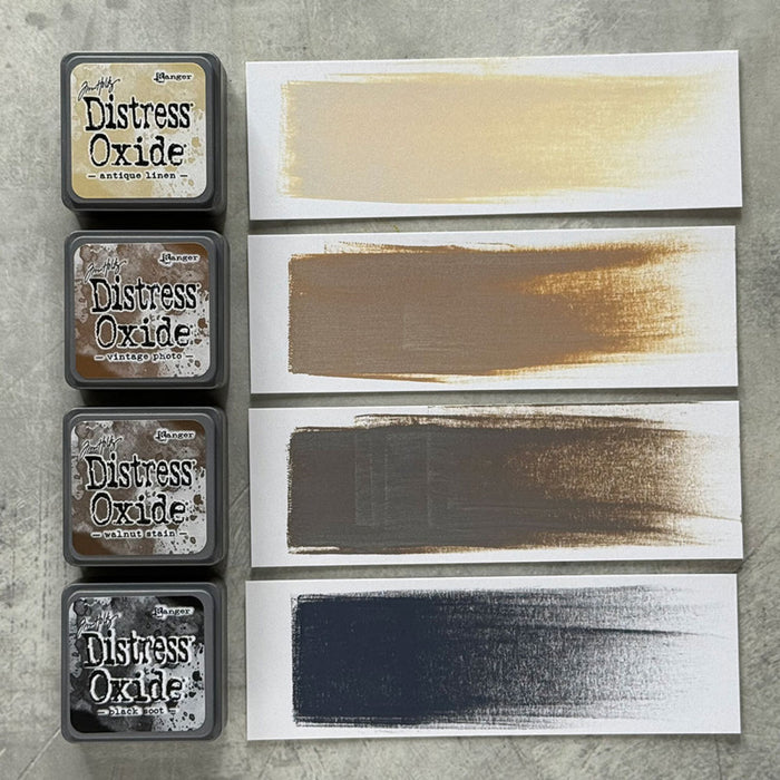 Ranger - Tim Holtz - Distress Mini Oxide Ink Pads Kit, #6 (4pc). Colours: Antique Linen, Vintage Photo, Walnut Stain and Black Soot. Available at Embellish Away in Bowmanville Ontario Canada.