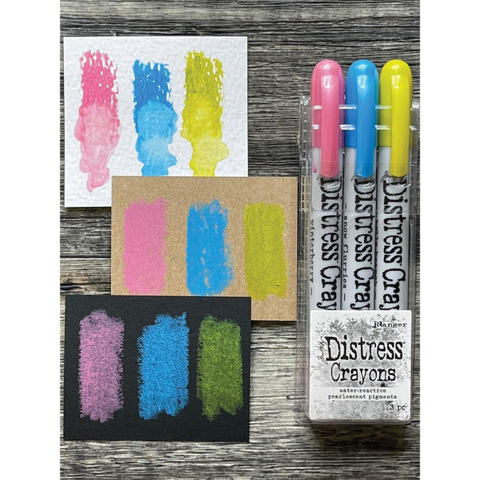 Tim Holtz - Distress Crayon Pearl Set - Holiday Set# 2. Distress Crayons are formulated to achieve vibrant pearlescent coloring effects on porous surfaces for mixed-media. The smooth water-reactive pigments are ideal for creating brilliant backgrounds, water coloring, smudge effects and more! Color directly onto surfaces and blend with water, then layer with Distress Inks or Stains for endless creative possibilities. Available at Embellish Away located in Bowmanville Ontario Canada.