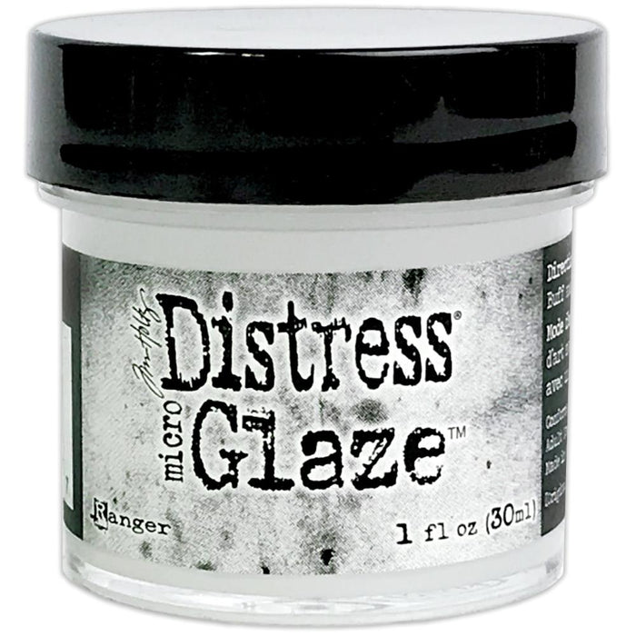 Ranger - Tim Holtz - Distress Micro Glaze - 1oz. Perfect for use on paper crafting projects, watercolors and ink jet printing. Now there is a way to seal your Distress projects. The new Tim Holtz Distress Micro Glaze is the perfect water resistant sealer for craft projects. Ideal for sealing Distress Ink, Markers, Stain, Paint & more. Easy to apply, Micro Glaze dries to a smudge resistant, waterproof finish. Available at Embellish Away located in Bowmanville Ontario Canada.