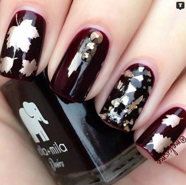 Wine Me Up burgundy nail polish with white leaf and gold foil nail art