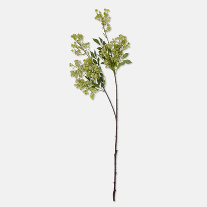 Artificial greenery branch on a white background