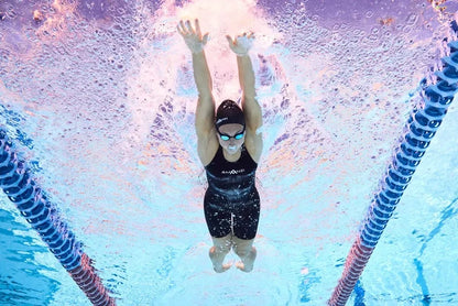 Amani Womens Acceler8 RIZE Kneesuit in Jet and Spearmint, sleek wetsuit for women, with a fitted design and smooth material.
