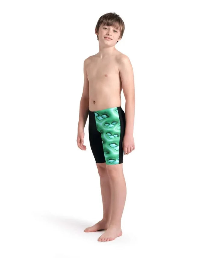 Arena boys' logo graphic swim jammer in black, soft green, and multi-colored design, shown on a young swimmer's body.