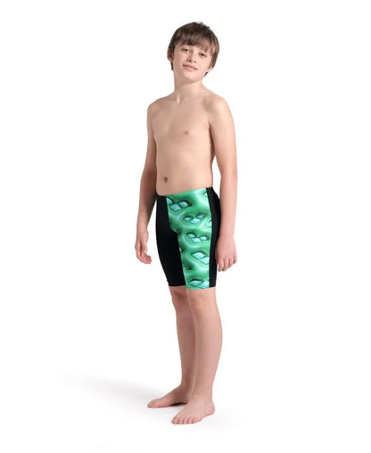 Arena boys' logo graphic swim jammer in black, soft green, and multi-colored design, shown on a young swimmer's body.