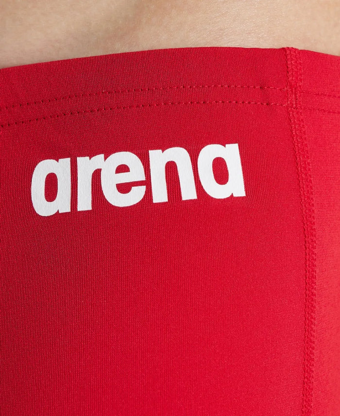 Arena boys' swim jammers in solid blue with the Arena logo, designed for competitive swimming.