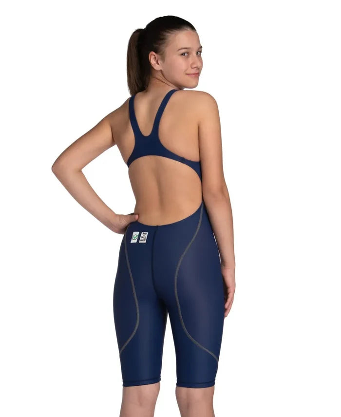 Arena Girls Powerskin ST Next Navy Kneesuit for ages 8-9, featuring a sleek design and durable fabric for competitive swimming.