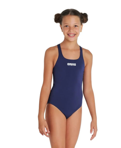 Arena Girls Team Swim Pro solid navy blue swimsuit for girls, featuring a sleek, comfortable design for competitive swimming.