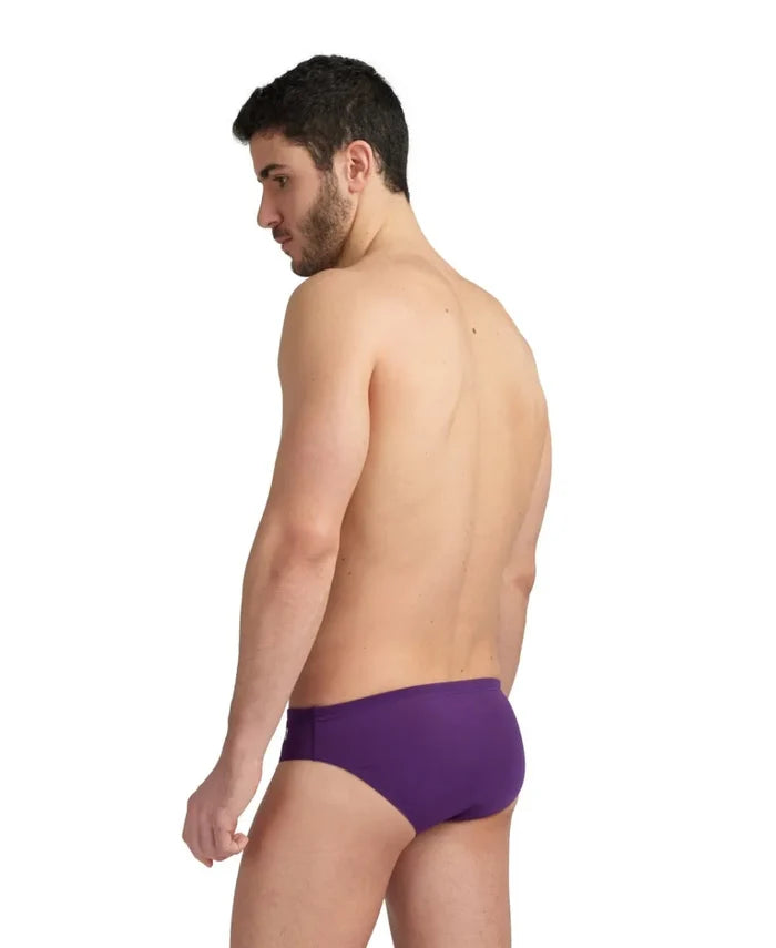 Arena men's solid team swim briefs in plum and white, featuring a sleek design and comfortable fit for competitive swimming.