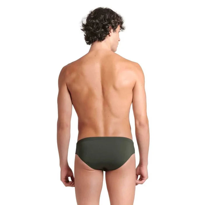 Arena Men's Team Solid Swim Brief in Dark Sage and White, showing the fitted swimwear with sleek design and supportive fabric.