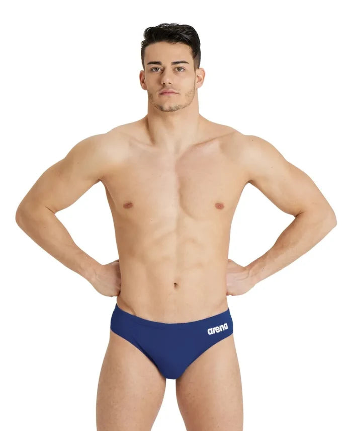 Navy blue Arena men's team swim briefs with a solid design, featuring a snug fit and comfortable waistband for swimming.