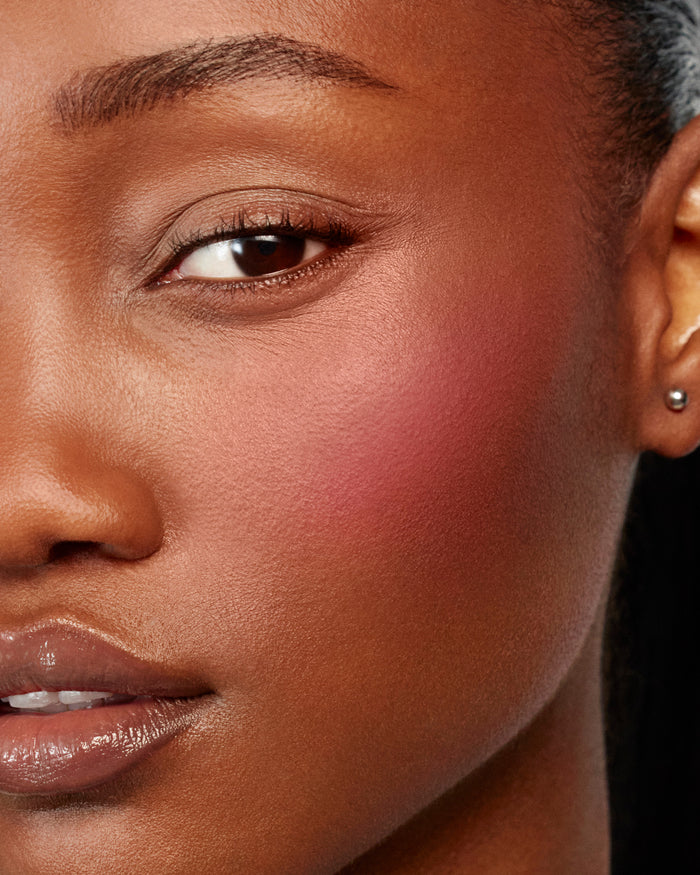 Model wears Baby Cheeks & Face Trace Sculpting Powder Duo in Poppet / Ganache.