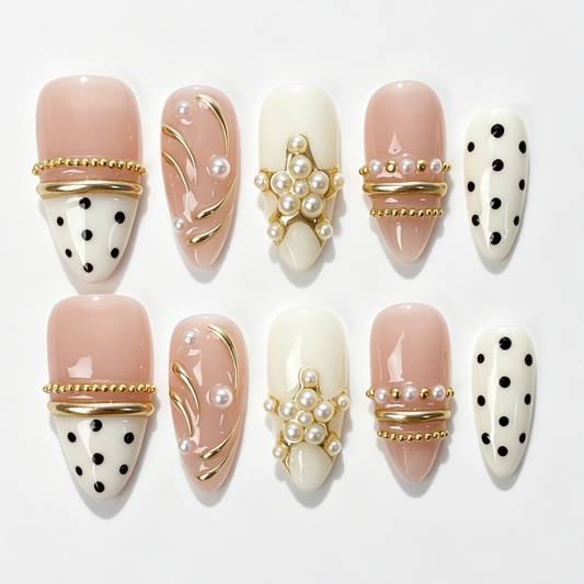 Blush‑Dot medium almond press‑on nails, nude cream base, black polka dot, pearl clusters & gold line decor fake nails