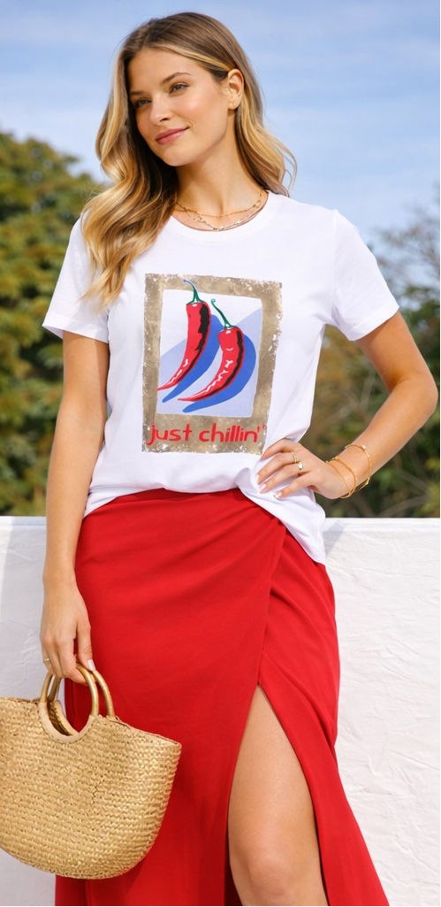 Three women wearing a t-shirt with a chili pepper graphic design.