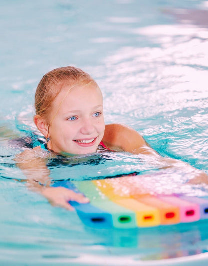 Rainbow coloured Comfy Kickboard swim noodle with grip holes