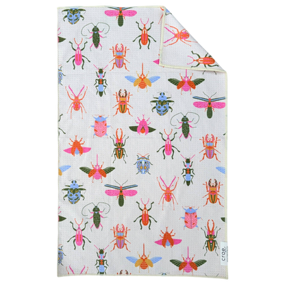 Folded fabric with colorful bug pattern on a white background