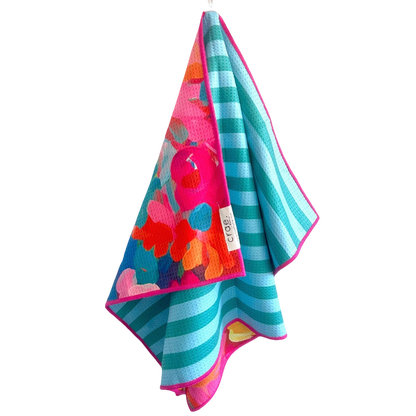 Colorful towel with floral pattern and stripes on a white background