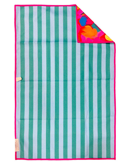 Striped blanket with green and white stripes and a colorful corner on a white background