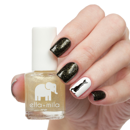 Dipped in Gold shimmer nail polish with black and white bow accent nail art