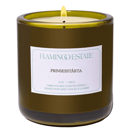 Flamingo Estate Green glass candle vessel with a white label prinsesstarta fragrance label 8oz