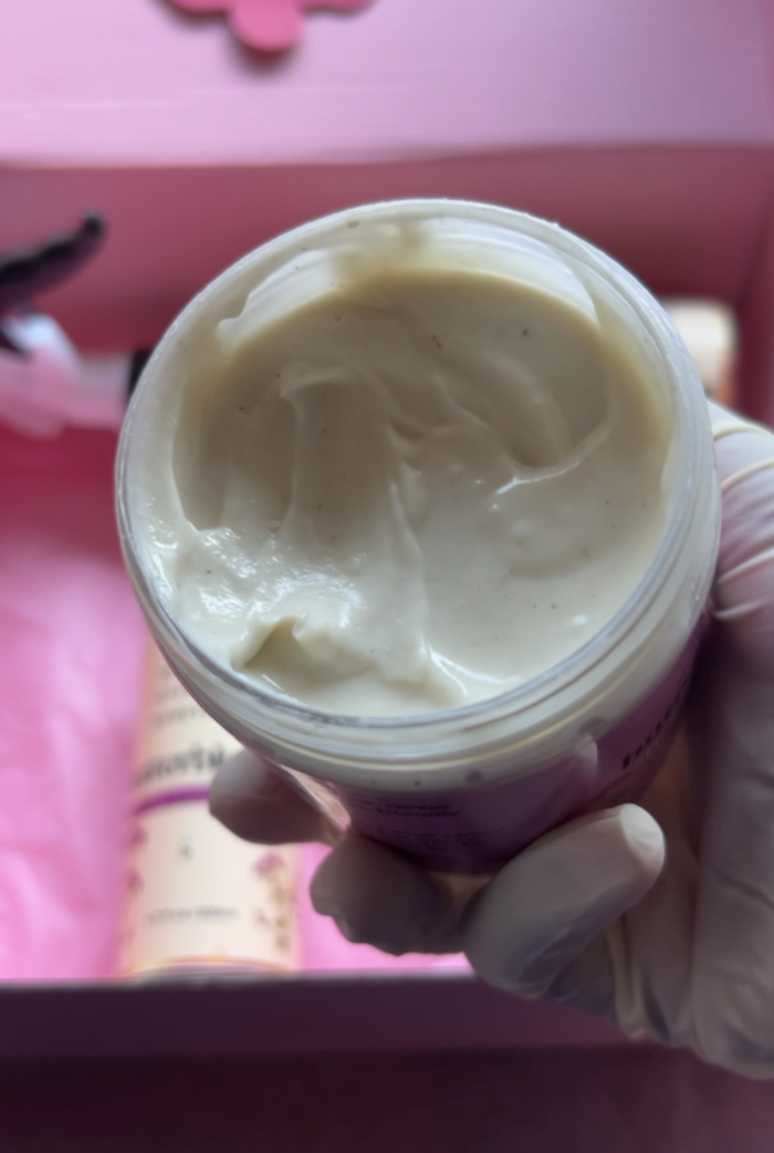 Creamy butterbloom hair butter cream jar with textured lid, showcasing the nourishing product for soft, shiny hair.