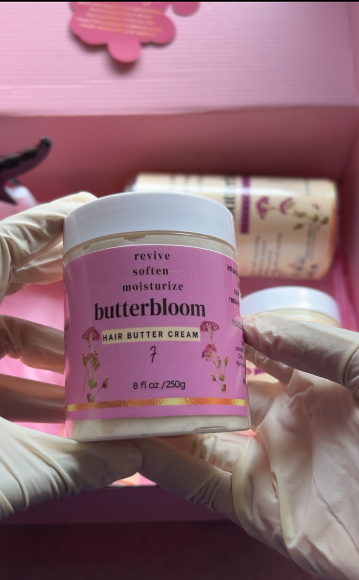 Creamy butterbloom hair butter cream in a jar, smooth texture and rich formula for nourishing curly hair.