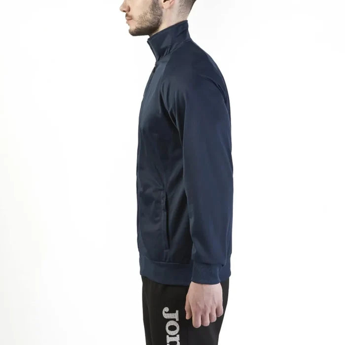 Joma Boys Gala Navy Jacket featuring a zip-up front, ribbed cuffs, and sporty design, ideal for active kids.
