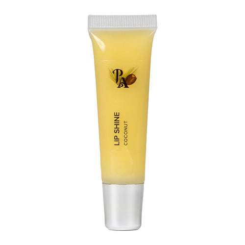 A tube of Pure Anada Lip Shine with a yellow tint, labeled 'LIP SHINE COCONUT', indicating a creamy coconut scent for the lip gloss.