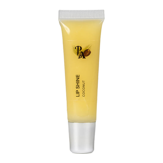 A tube of Pure Anada Lip Shine with a yellow tint, labeled 'LIP SHINE COCONUT', indicating a creamy coconut scent for the lip gloss.