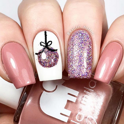 Luminous mauve pink nail polish with ornament and purple glitter accent nail art