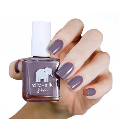 Mauve Over muted mauve nail polish manicure on a light skin tone with the bottle