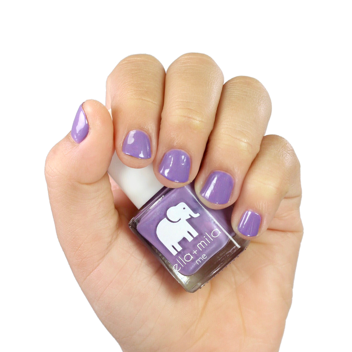 Mila's Fave light purple nail polish manicure on a light skin tone with the bottle
