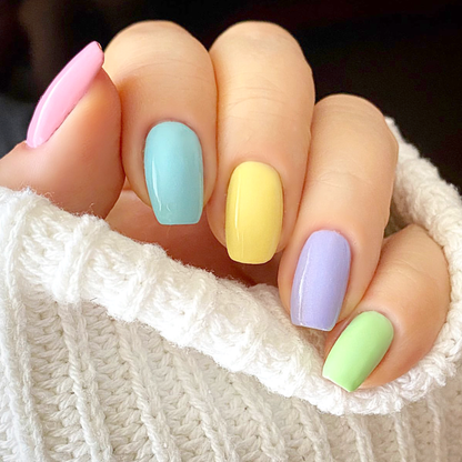 Ombre Collection pastel rainbow manicure in pink, blue, yellow, lavender and mint on a light skin tone