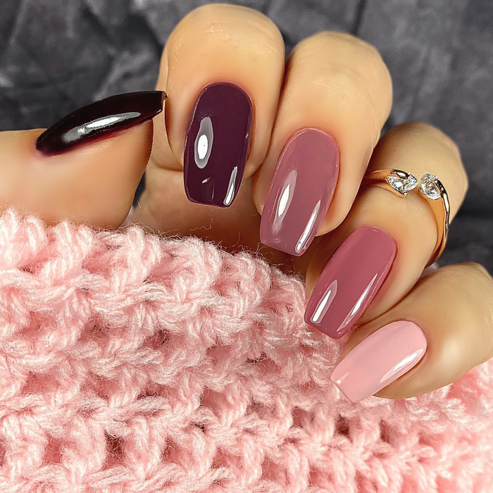 Ombre Collection berry gradient manicure from dark plum to mauve to pale pink with rings