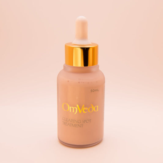 OmVeda 50ml clearing spot treatment bottle with gold dropper cap