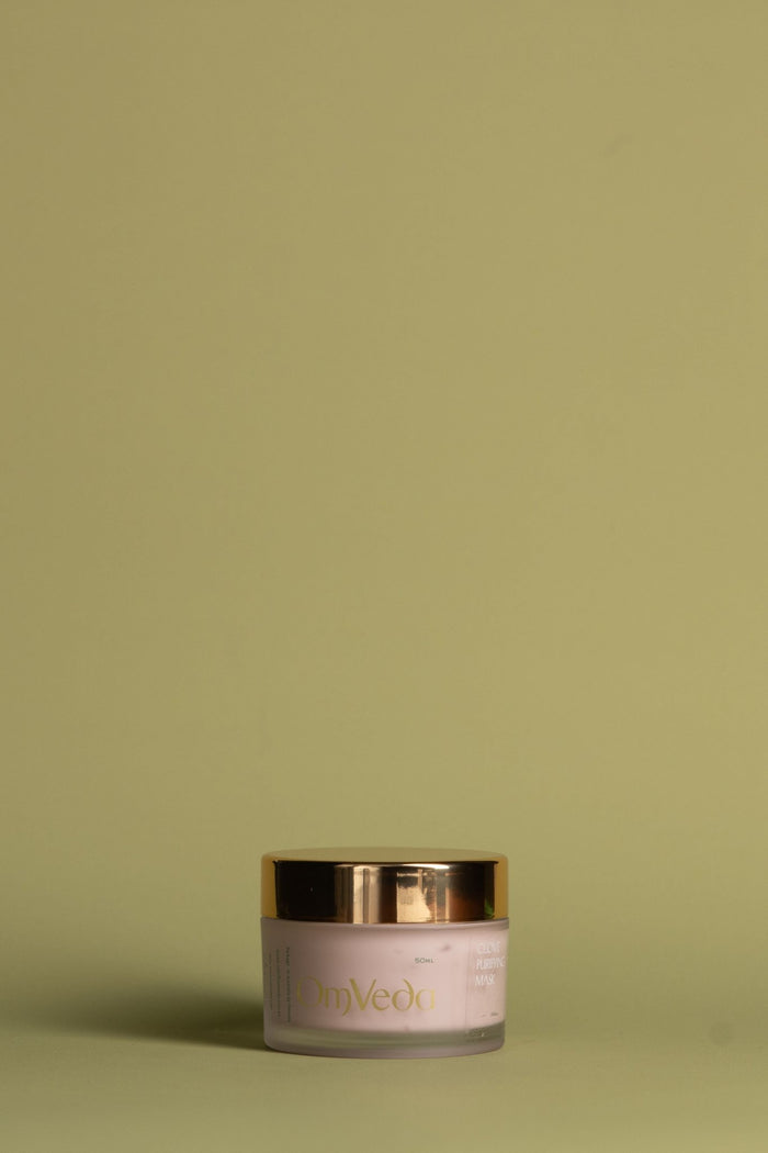 OmVeda Clove Purifying Mask jar with gold lid, soft pink body, 50 ml