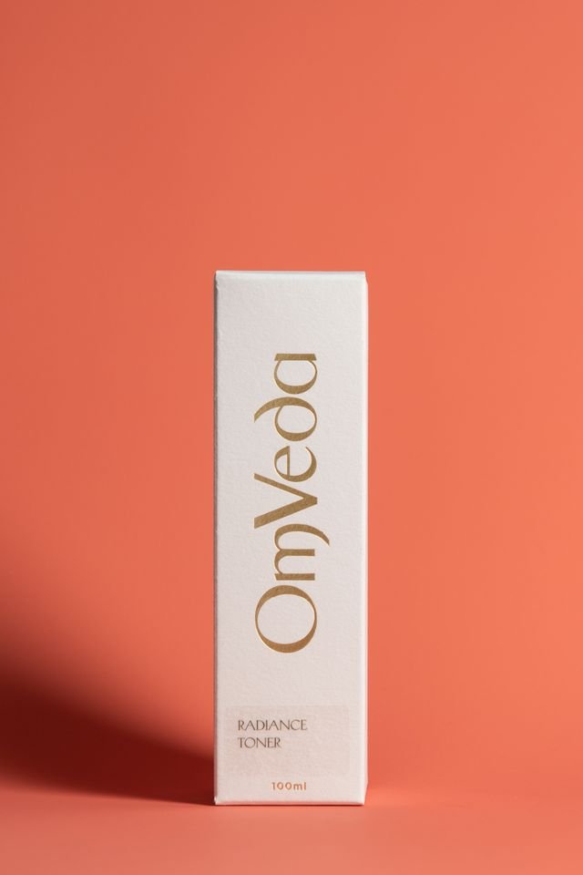 OmVeda Radiance Toner 100ml box, white with gold lettering