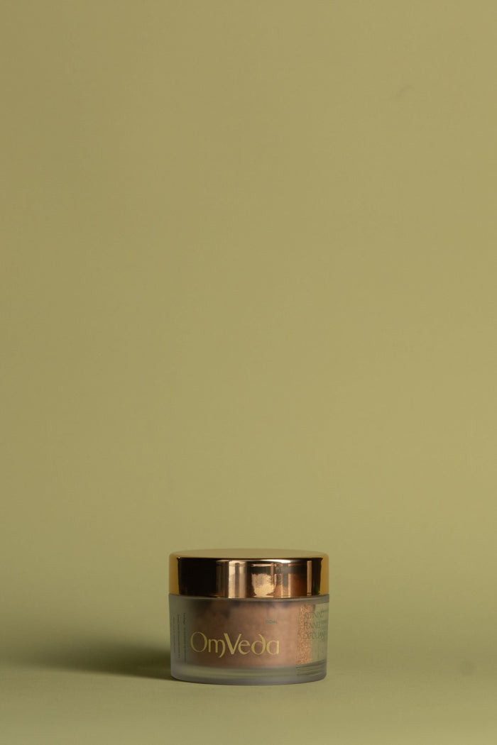 OmVeda refining fennel exfoliant jar, 50ml, with gold screw lid.