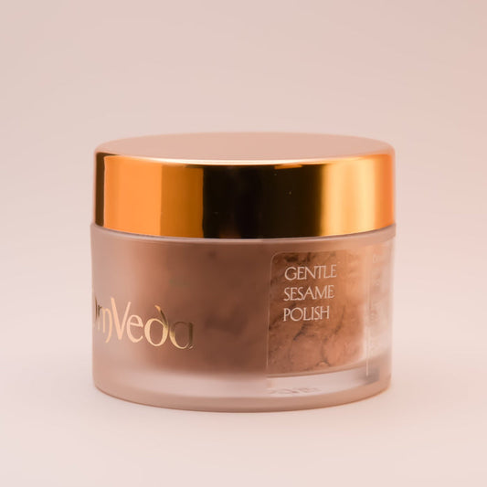 OmVeda Gentle Sesame Polish jar, gold lid, beige powder inside