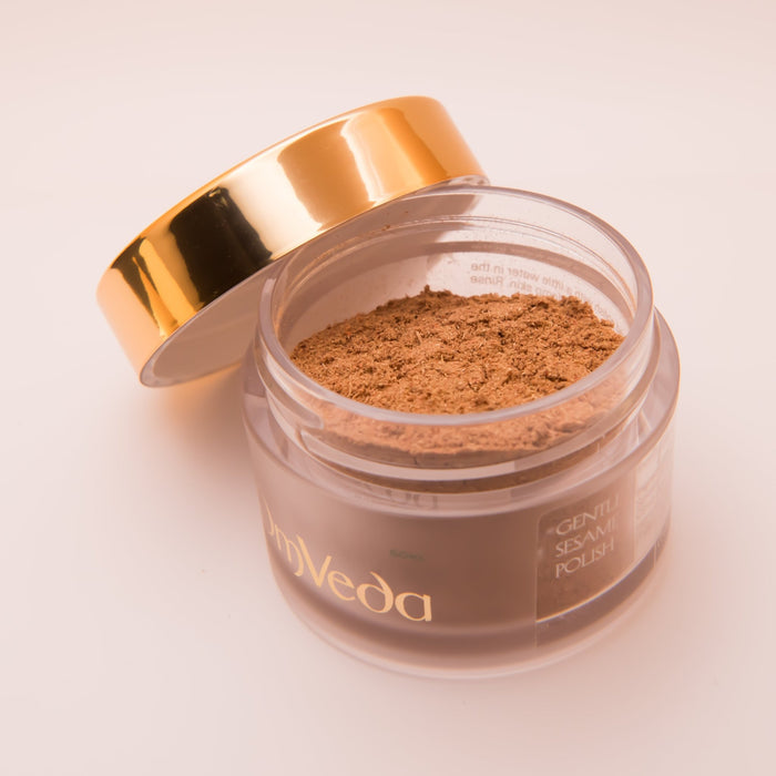 OmVeda Gentle Sesame Polish jar open, showing brown exfoliant powder