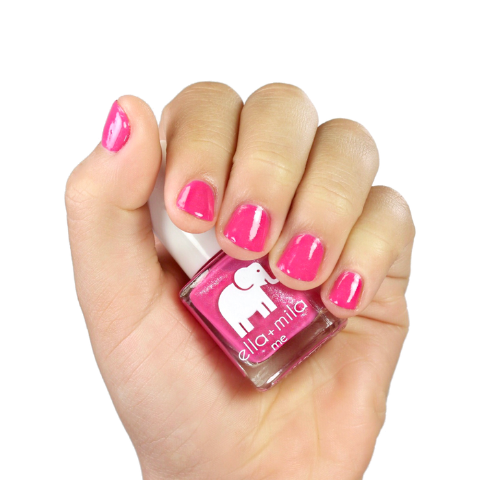 Pretty Princess hot pink shimmer nail polish manicure on a light skin tone with the bottle