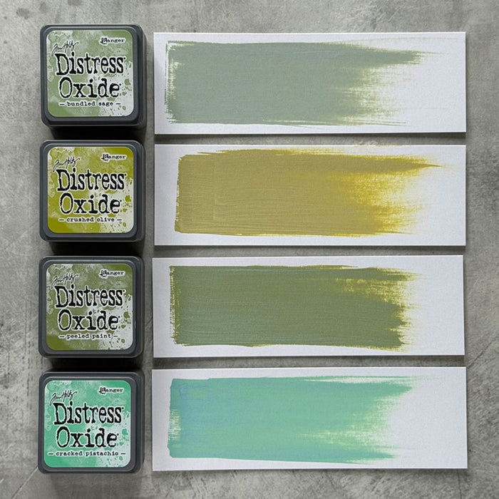 Ranger - Tim Holtz - Distress Mini Oxide Ink Pads Kit, #3 (4pc). Colours: Bundled Sage, Crushed Olive, Peeled Paint and Cracked Pistachio. Available at Embellish Away in Bowmanville Ontario Canada.