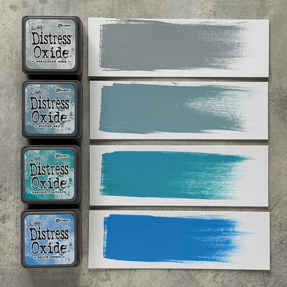 Ranger - Tim Holtz - Distress Mini Oxide Ink Pads Kit, #4 (4pc). Colours: Weathered Wood, Stormy Sky, Peacock Feathers and Salty Ocean. Available at Embellish Away in Bowmanville Ontario Canada.