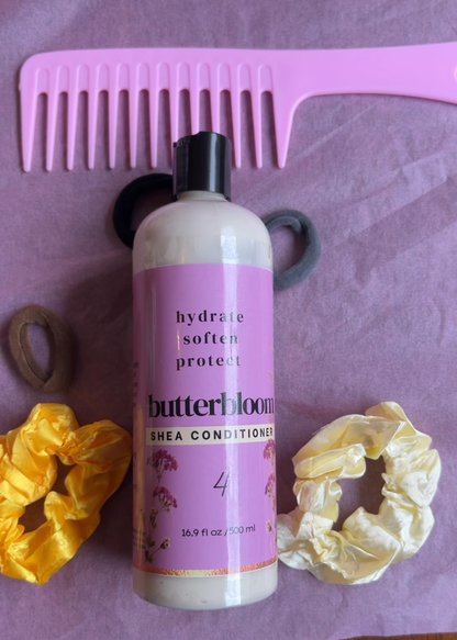 Creamy butterbloom Shea Conditioner bottle with label, designed for nourishing and moisturizing hair care.
