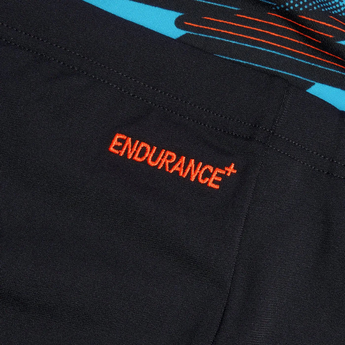 Speedo men's HyperBoom Panel jammer swimwear in black, Picton Blue, and Siren Red with panel design for competitive swimming.